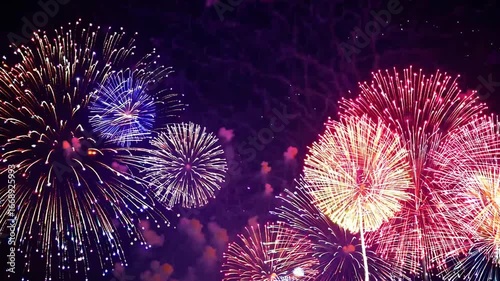 Multicolored pyrotechnic explosion backdrop with available area for wording, joyous upcoming year 2026