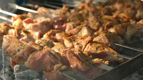 Wallpaper Mural Close-up of many pieces of meat shashlik on skewers roasting over open fire on a barbecue. Meat coated with spices, large batch for a group, just starting to cook, traditional outdoor cooking. Torontodigital.ca