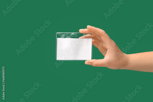 Female hand with blank badg...