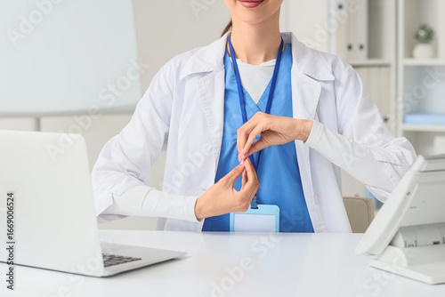 Female doctor meditating at...