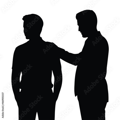 Supportive mentor offering encouragement to a younger colleague, fostering collaboration and teamwork in a professional setting
