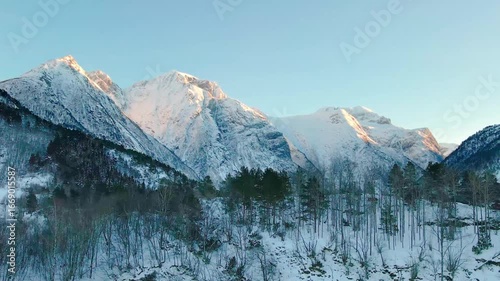 aerial footage showcasing the majestic winter landscape of the Eresfjord and Eikesdalen region in Norway.