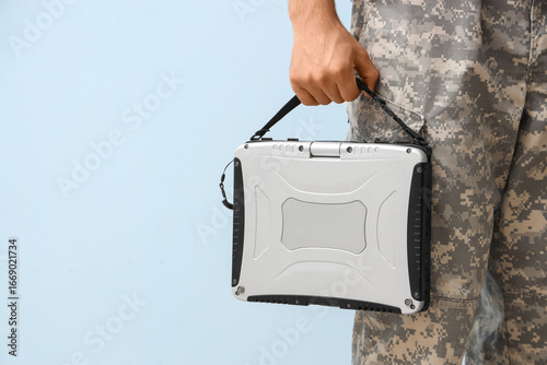 Young soldier with military...