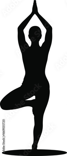 Woman practicing yoga tree pose silhouette