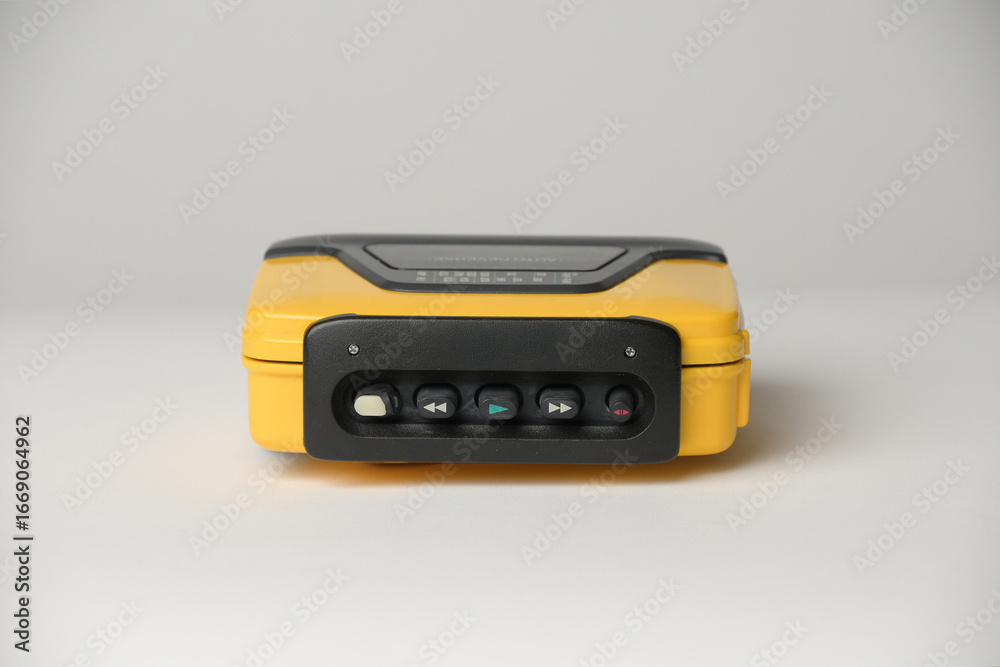 Fototapeta premium Retro cassette player with earbuds, 1990s