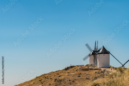 Iconic Consuegra Windmills Under Bright Summer Sky