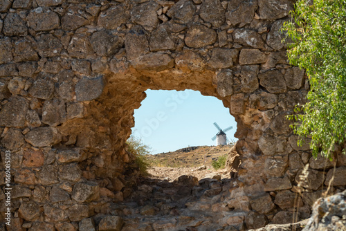 Historic Consuegra Windmills in Spain Framed by Ancient Stones