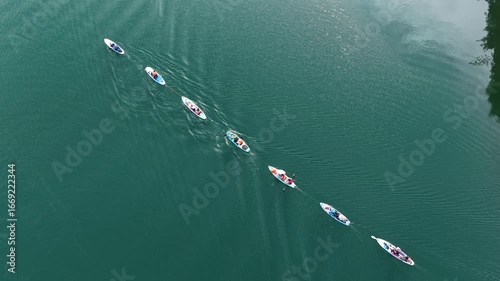 Aerial photography of paddleboard enthusiasts on a freshwater lake
