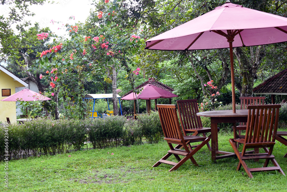 Obraz premium table and chairs in a garden