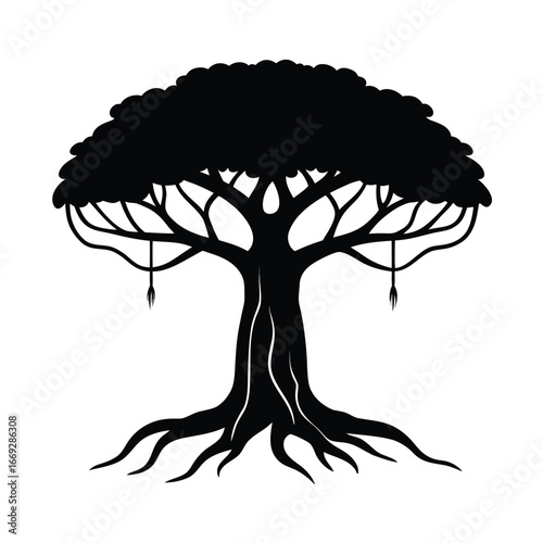 Majestic giant banyan tree silhouette with thick trunk