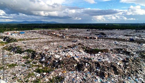 Landfill filled with waste and plastic debris shows environmental challenges in waste management