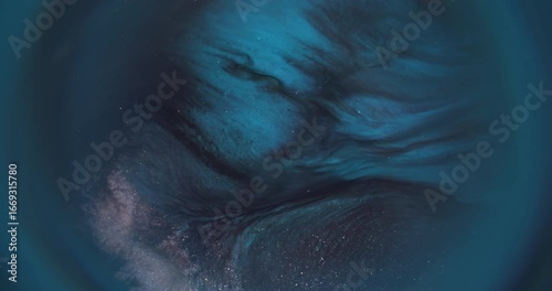 Spark glitter paint. Blur ripple background. Defocused blue color fluid water texture shiny liquid floating on dark black abstraction.