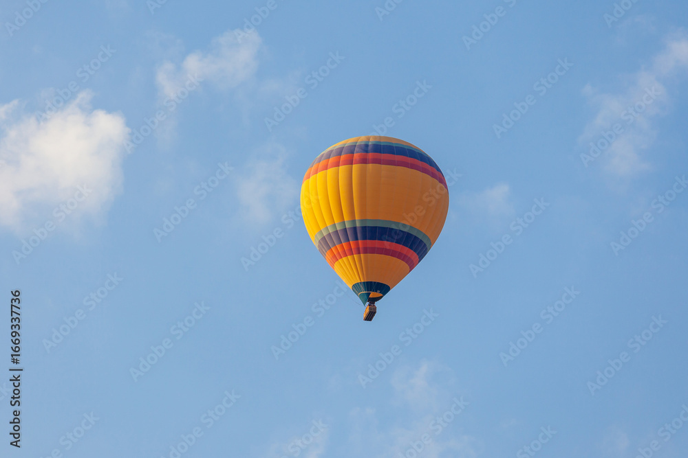 Naklejka premium Three hot air balloon against a blue sky. Beautiful view of colourful hot air balloons from below. Cappadocia
