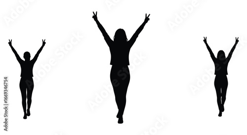 Silhouettes of woman jumping up with arms raised in celebration