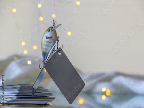 Credit card mockup friendly on a fishing lure bait for phishing scam for fraudulent purposes especially during holidays stealing user data. Identity thefts concept. 