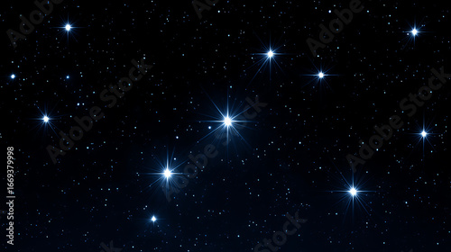 Bright stars scattered across a dark night sky, featuring a prominent constellation with glowing points and a vast field of smaller distant stars