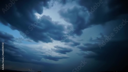 Heavy storm clouds and bright lightning flashes during a severe weather event