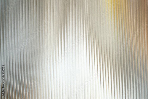 A textured background with vertical ribbed patterns that create a sense of depth and abstract visual interest