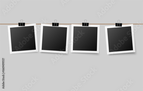 Photographs hanging on a string attached with office clips, cozy decorative concept perfect for personal memory boards, wall displays, or creative layouts.
