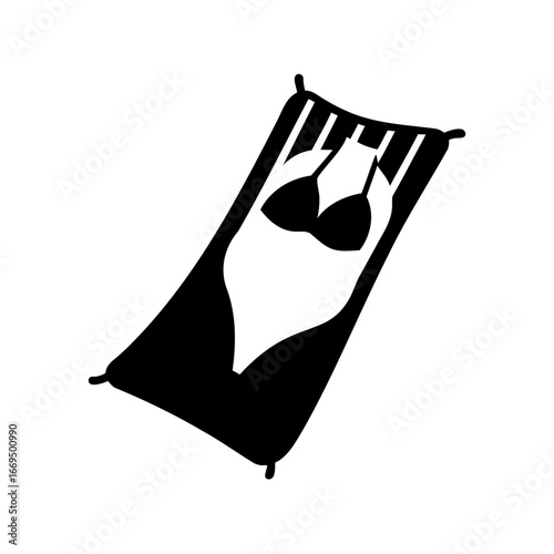 Black swimsuit on a deck chair symbolizing summer vacation and relaxation