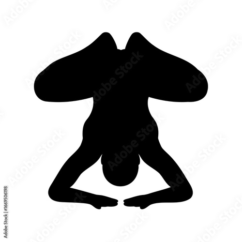 Silhouette of a person in a wide legged supported headstand pose