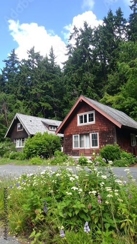 Two wooden houses nestled among lush greenery