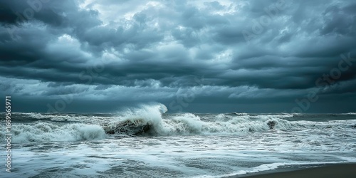 Fototapeta Naklejka Na Ścianę i Meble -  Dark skies and crashing waves as a hurricane nears the shoreline Stock photo