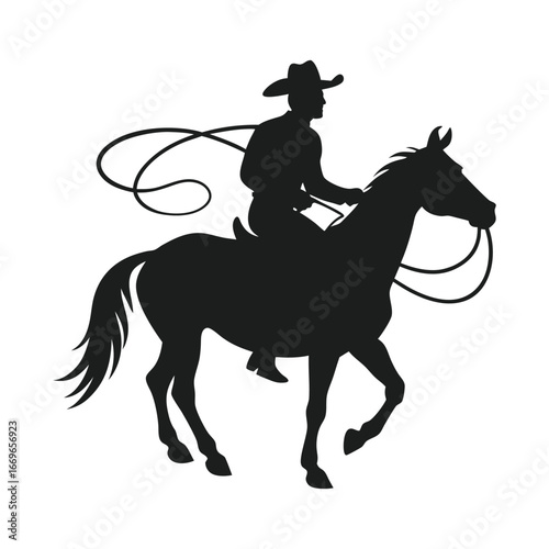 silhouette of a cowboy riding a horse with a lasso