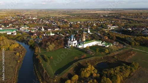 panoramic aerial view of Suzdal kremlin and kamenka river in autumn at sunset