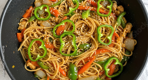 Delicious Sesame Noodles with Chicken and Bell Peppers.