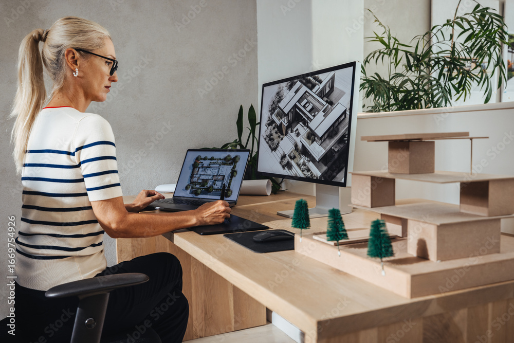 custom made wallpaper toronto digitalArchitect working on building designs with computer and physical scale model