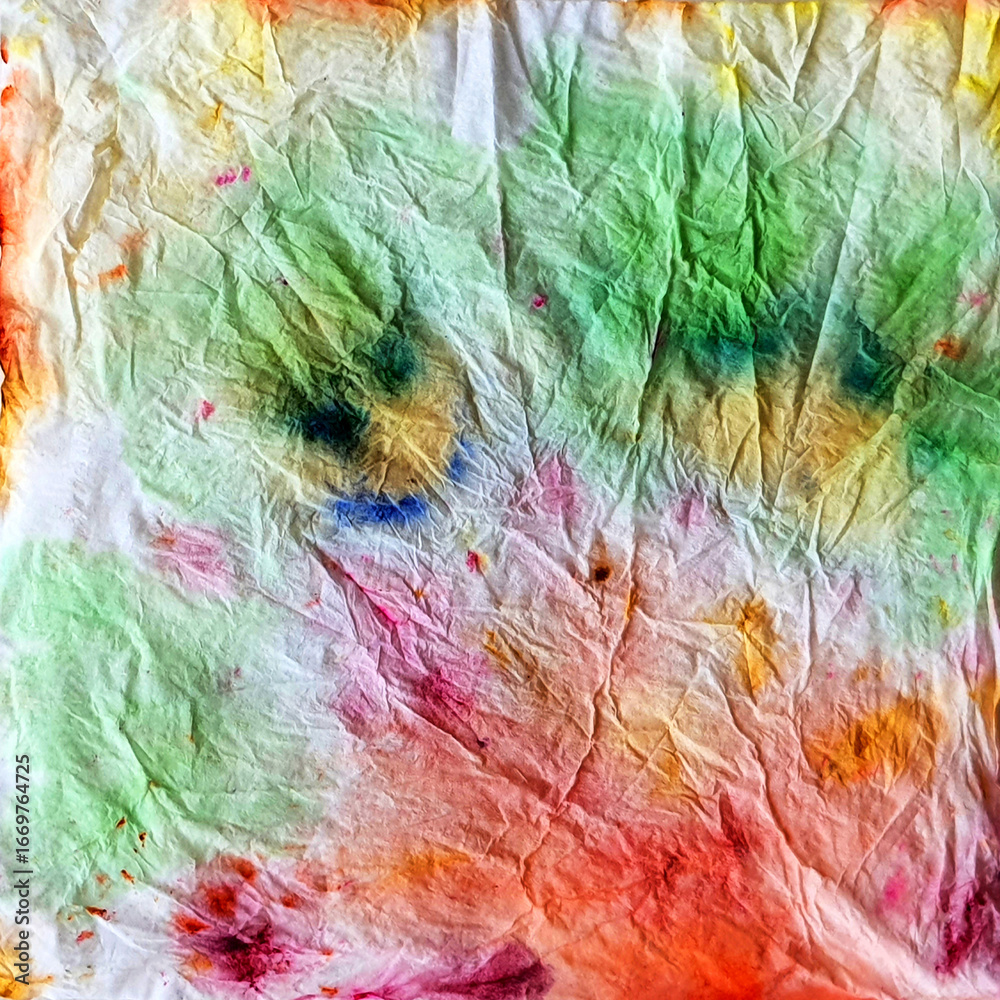 Obraz premium This vibrant, abstract, tie-dye drip art on paper showcases unique watercolor symmetry and textures. Perfect for use as a background, modern art design, and creative decoration.