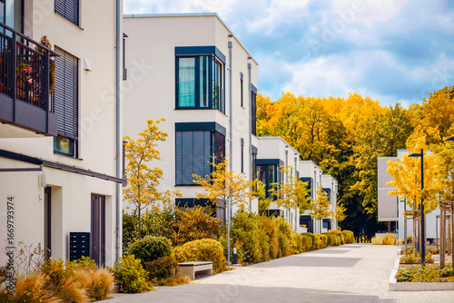 Autumn Landscape of Residential Apartment Building. Modern Facade Building on Fall Autumn Background. 
