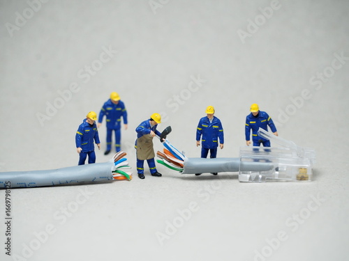 Mini toy at table with blurred background. Industrial Engineer concept design.