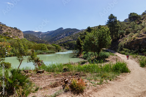 Hikers on the lake shore