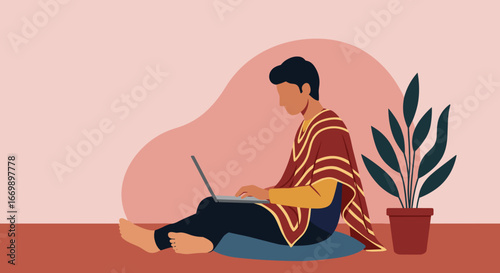Young man working remotely on a laptop in a cozy home setting, highlighting comfort, focus, and modern freelance lifestyle. Ideal for digital nomad concepts.