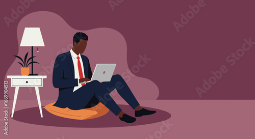 Professional man working remotely on a laptop from home, sitting comfortably on a cushion. Represents flexible work, entrepreneurship, and modern business productivity.