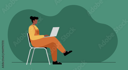 A woman in overalls sits on a chair, focused on her laptop. Represents remote work, freelance, online education, or digital nomad lifestyle. Ideal for business, technology, and lifestyle content.