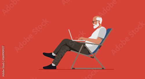 Relaxed senior man with a beard and glasses working or browsing on a laptop in a casual chair. Modern digital lifestyle for older adults.