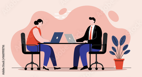 Two business professionals working diligently on laptops at a desk, representing productivity, teamwork, and modern office collaboration.