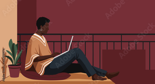African American woman working remotely on a laptop from a comfortable home balcony, showcasing modern freelance lifestyle.