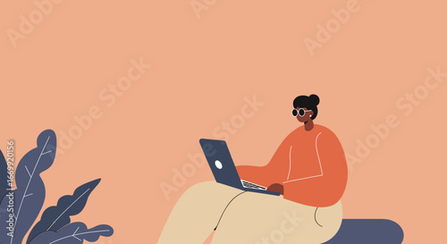 Stylish woman in glasses works on a laptop, embodying remote work and digital lifestyle. Ideal for business, technology, or creative concepts.
