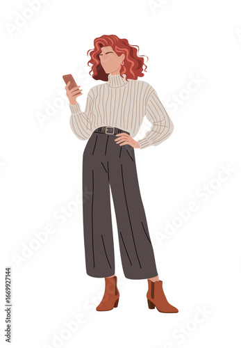 Flat vector illustration of tall woman with curly red hair, wearing belted knit sweater, wide-leg trousers, suede ankle boots, standing focused on her phone. Isolated on transparent background