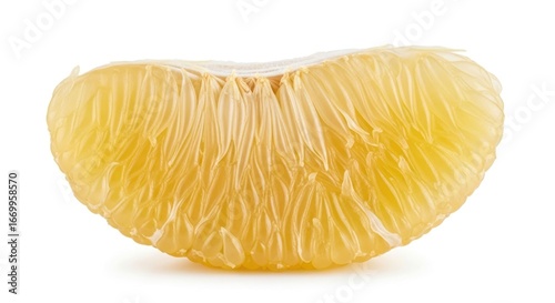 Close-up pomelo segment, pale yellow flesh