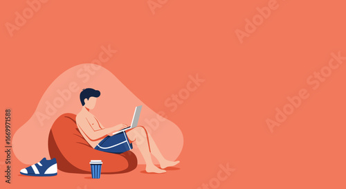 Young man comfortably working on a laptop from a bean bag chair, embodying a modern remote work lifestyle or freelance flexibility.