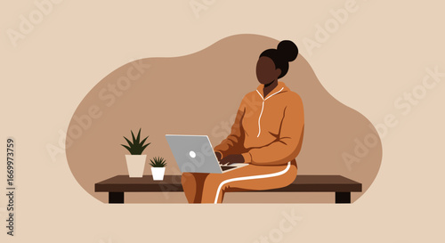 Young woman in a tracksuit comfortably working on her laptop from home, embodying remote work and digital nomad lifestyle. Ideal for business, technology, and lifestyle concepts.