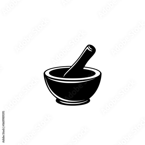 Mortar and pestle used in traditional cooking and herbal preparation on a wooden surface