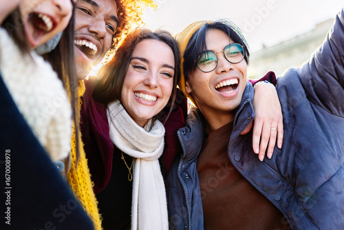 Wallpaper Mural Diverse group of young friends having fun together outdoors on winter. Millennial student people laughing walking in city street enjoying day off. Youth community and friendship concept. Torontodigital.ca
