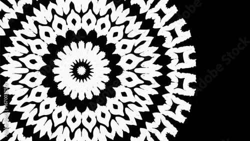 Circular pattern of white floral designs on a black background creating a symmetrical arrangement design silhouette