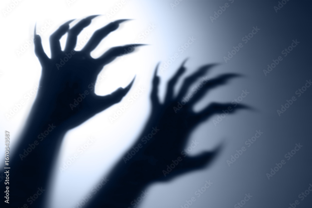 Obraz premium Shadow overlay effect for halloween background with Terrifying scary hands with long nails,Creepy monster claw,silhouette of hands,zombie hand rising out of a graveyard